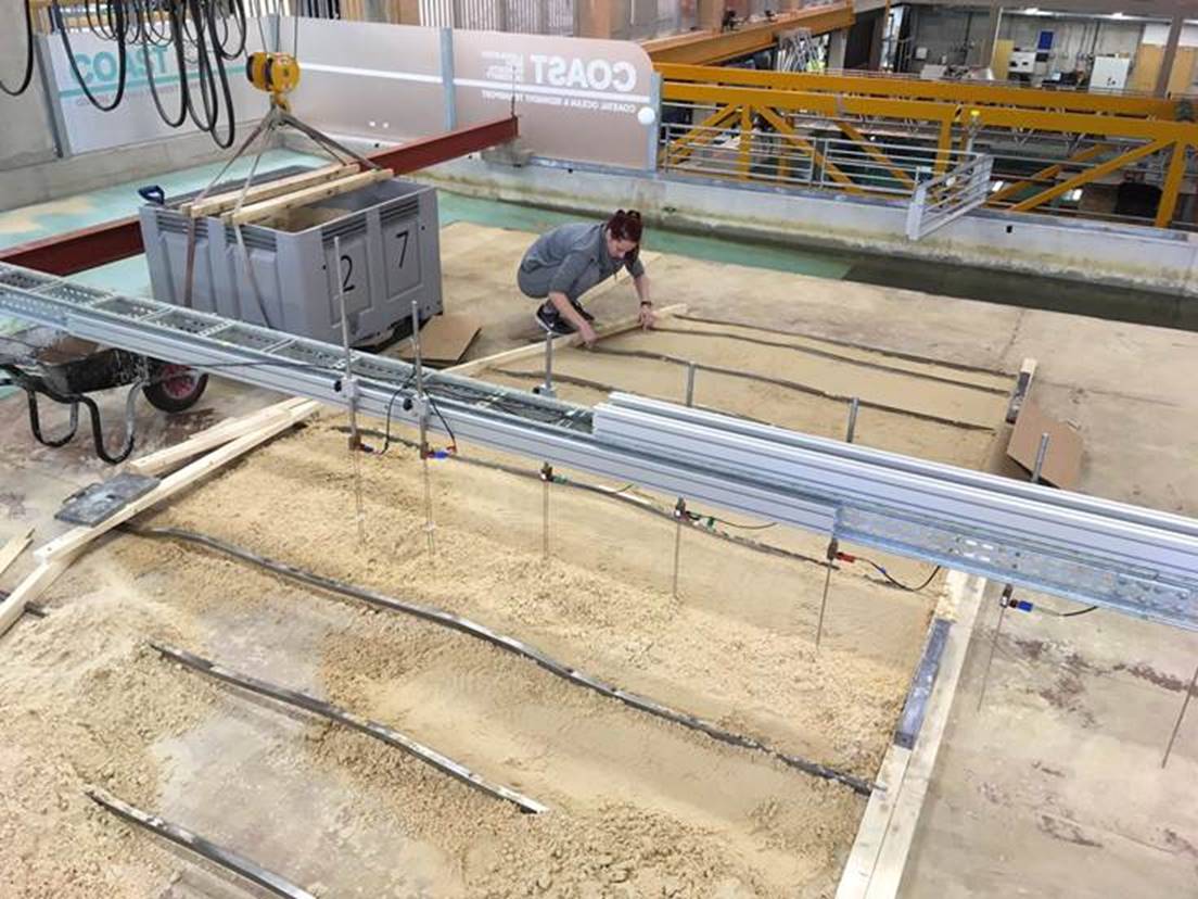 Scientists prepare a replica basin reef in a UK lab to simulate sea level rise. Photo / Supplied